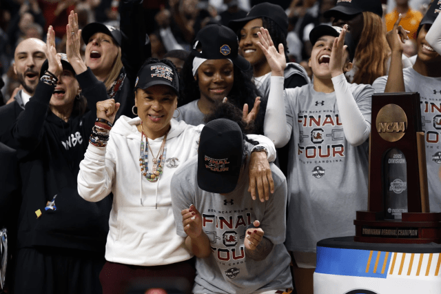 South Carolina head coach Dawn Staley celebrates with Gamecock players after defeating Duke to advance to the Final Four on Sunday, March, 30, 2025, in Birmingham, Ala. 