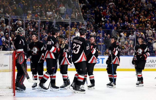 The Sabres celebrate an Atlantic Division victory over the Boston Bruins.