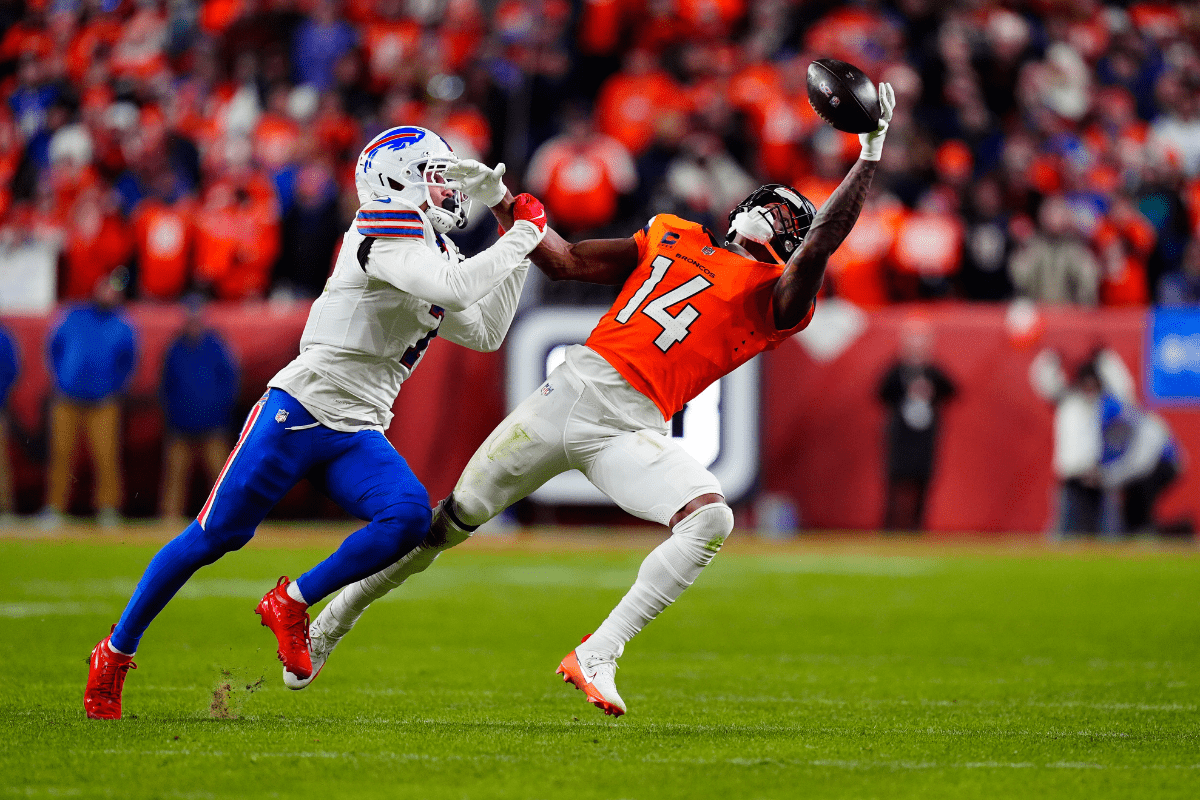 Jan 17, 2026; Denver, CO, USA; Buffalo Bills cornerback Taron Johnson (7) is called for pass interference on Denver Broncos wide receiver Courtland Sutton (14) during overtime of an AFC Divisional Round playoff game at Empower Field at Mile High. Mandatory Credit: Ron Chenoy-Imagn Images