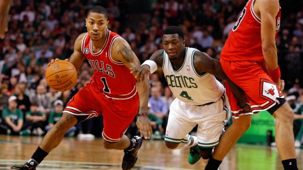 Derrick Rose Legacy: Chicago Bulls point guard Derrick Rose drives past Boston Celtics guard Nate Robinson at TD Garden.