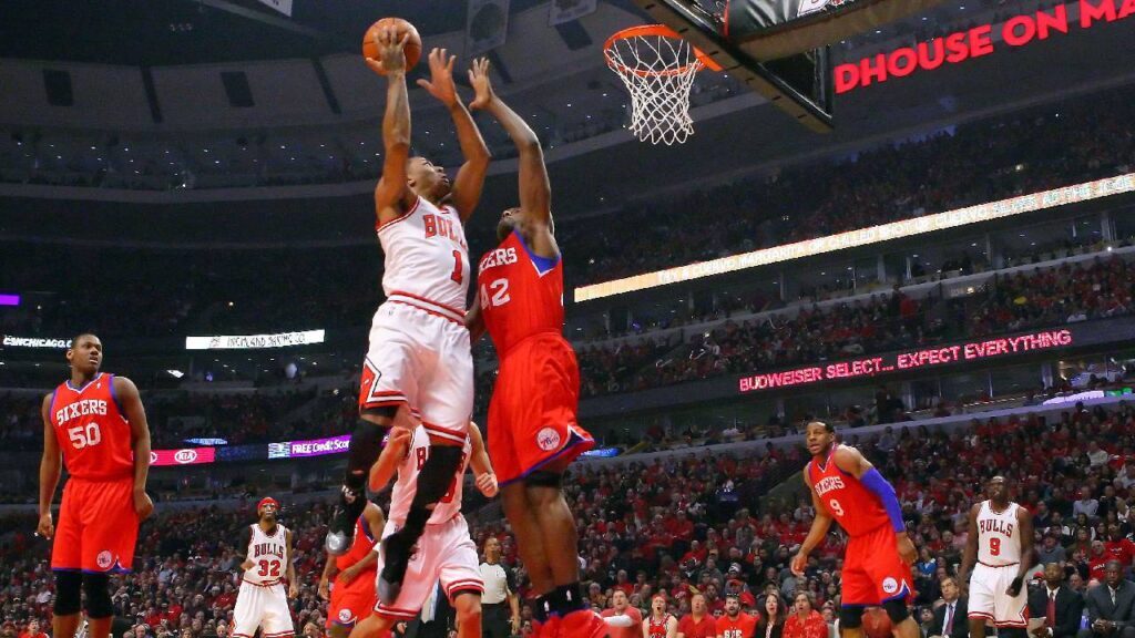 Derrick Rose Legacy: Chicago Bulls point guard Derrick Rose shoots over Philadelphia 76ers forward Elton Brand in the 2012 NBA playoffs.
