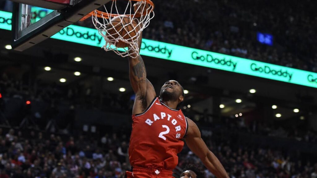 Kawhi Leonard dunks against the Philadelphia 76ers at Scotiabank Arena in Kawhi Leonard Contract Extension coverage.