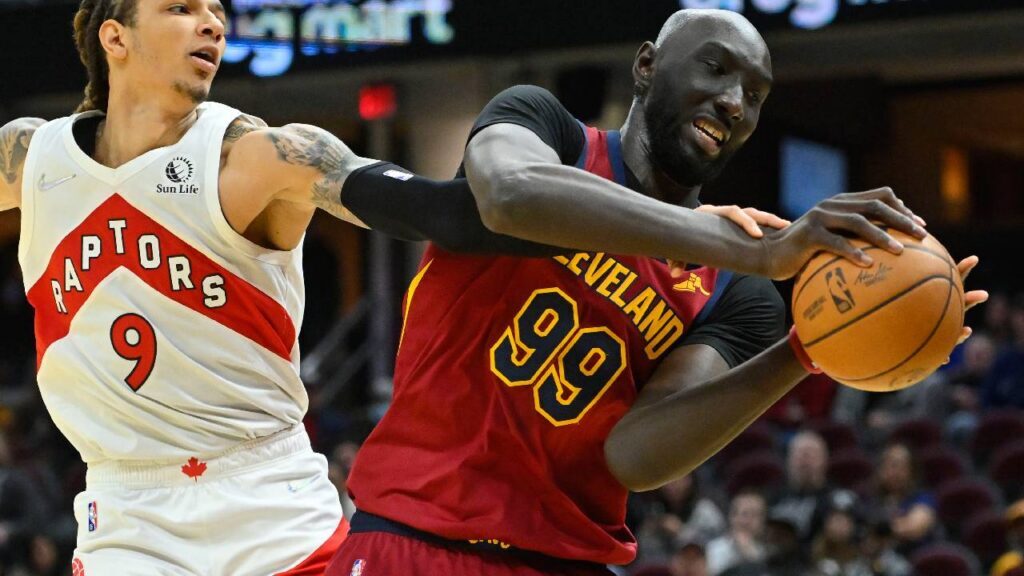 Toronto Raptors forward D.J. Wilson (9) and Cleveland Cavaliers center Tacko Fall (99) reach for a rebound in the fourth quarter at Rocket Mortgage FieldHouse.
