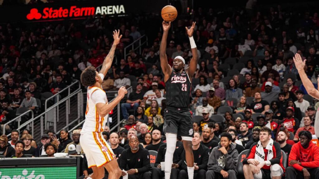 Former Trail Blazer Duop Reath shoots over Atlanta Hawks forward Dominick Barlow while with Portland, as the Phoenix Suns Mark Williams Injury creates a need for frontcourt depth.