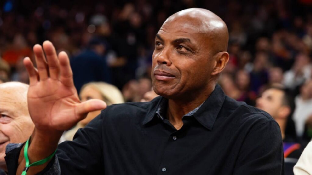 Phoenix Suns former player Charles Barkley sits courtside against the Minnesota Timberwolves during an NBA Cup game at Mortgage Matchup Center.