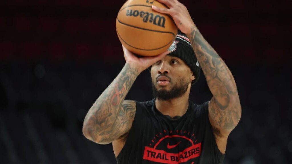 Portland Trail Blazers guard Damian Lillard (0), one of the NBA Veterans Without A Ring, shoots a three-point shot during warmups before the Trail Blazers play the Philadelphia 76ers at Moda Center.