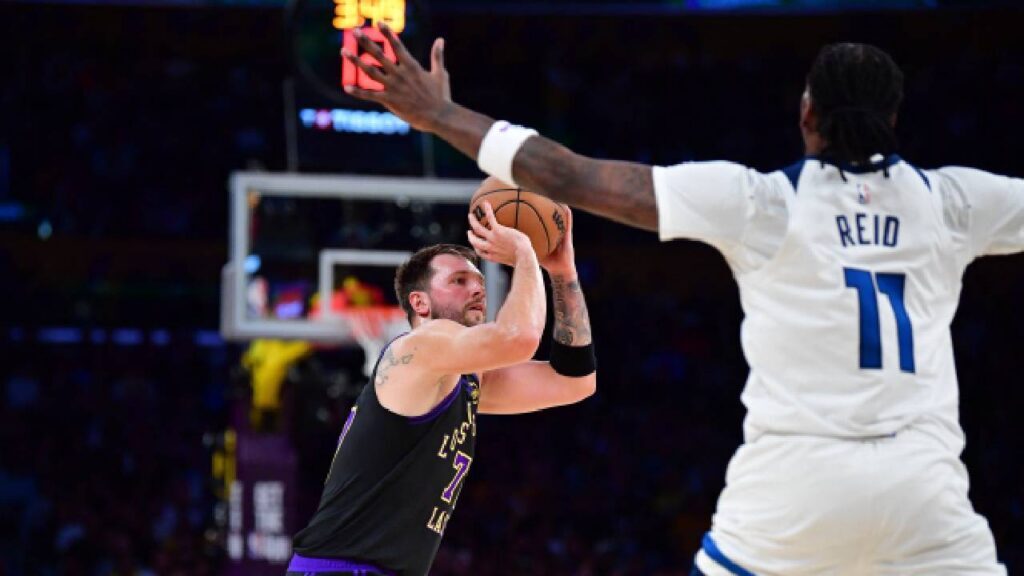 Los Angeles Lakers guard Luka Doncic (77) shoots against the Minnesota Timberwolves during the first half at Crypto.com Arena.