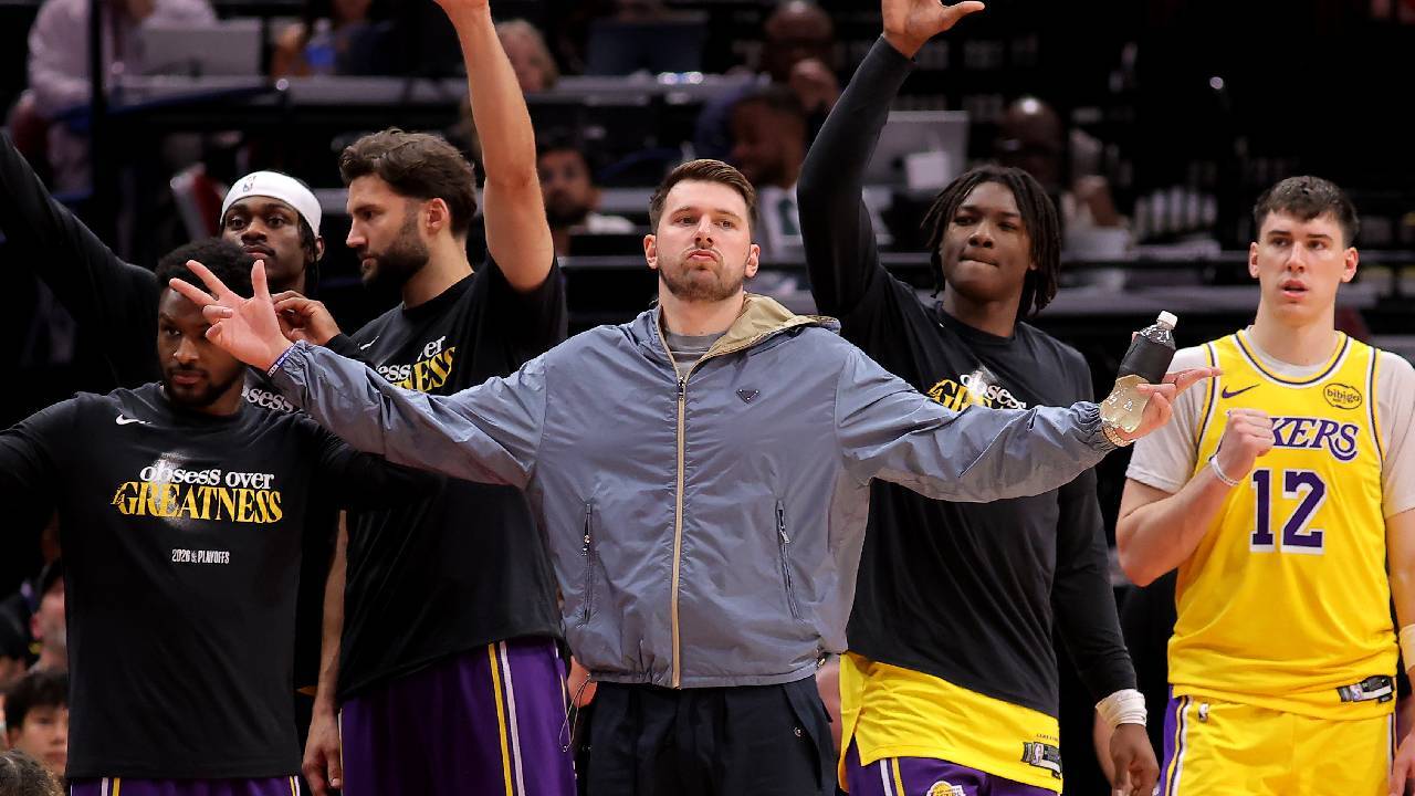 Los Angeles Lakers guard Luka Doncic (77, middle) reacts after a made basket against the Houston Rockets during the fourth quarter of game six of the first round of the 2026 NBA Playoffs at Toyota Center.
