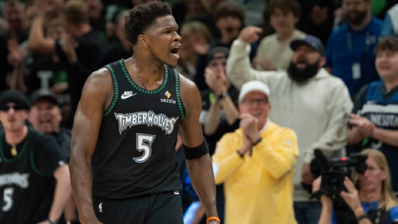Minnesota Timberwolves guard Anthony Edwards (5) celebrates after making a three point shot as time expires in the first quarter against the San Antonio Spurs during game three of the second round of the 2026 NBA Playoffs at Target Center.