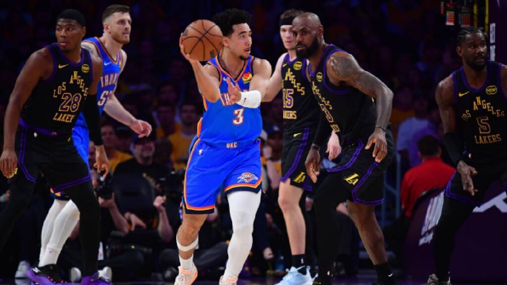 Oklahoma City Thunder guard Jared McCain (3) passes the ball against Los Angeles Lakers forward LeBron James (23) during the first half in game four of the second round of the 2026 NBA Playoffs at Crypto.com Arena.