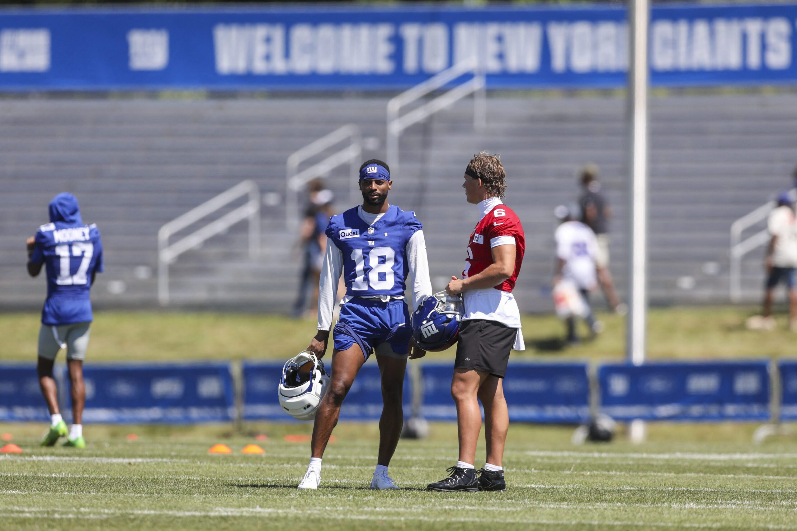 Jul 30, 2026; White Sulphur Springs, WV, USA; New York Giants wide receiver Darius Slayton (18) talks with New York Giants quarterback Jaxson Dart (6) during training camp at The Greenbrier Resort Sports Performance Center. Mandatory Credit: Ben Queen-Imagn Images