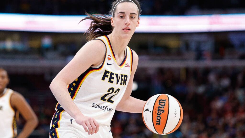 Indiana Fever guard Caitlin Clark (22) drives to the basket against the Chicago Sky during the first half of a WNBA game at United Center.