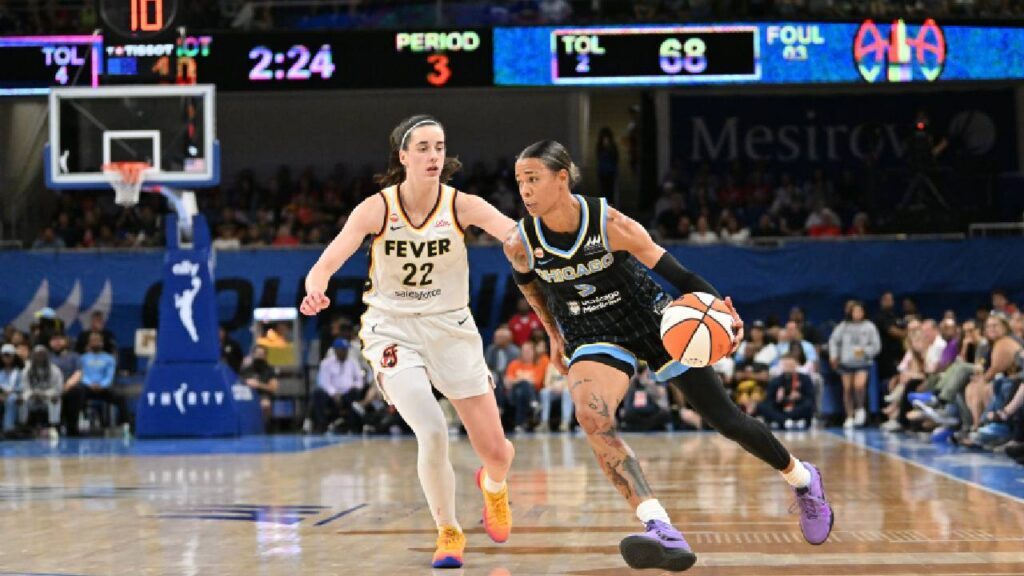 Chicago Sky guard Natasha Cloud (9) drives the ball against Indiana Fever guard Caitlin Clark (22) during the second half at Wintrust Arena.