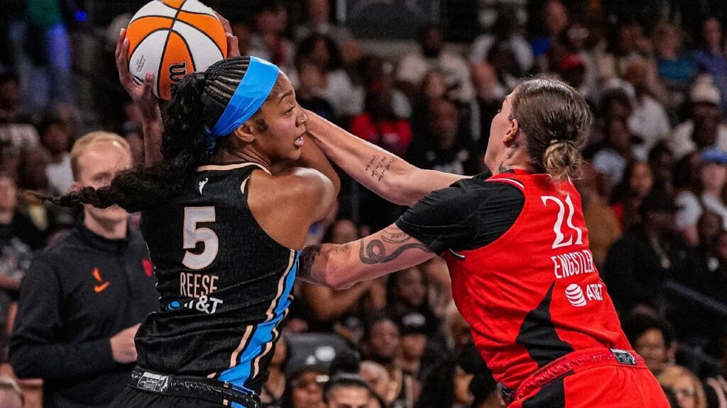 Atlanta Dream forward Angel Reese (5) and Portland Fire forward Emily Engstler (21) fight for the ball during the first half at Gateway Center Arena at College Park.