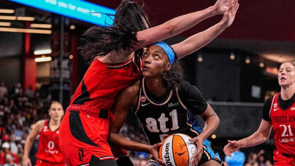 Atlanta Dream forward Angel Reese (5) works against Portland Fire center Megan DiLeo (17) during the second half at Gateway Center Arena at College Park.