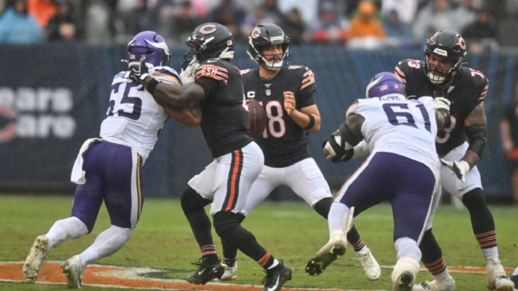 Chicago Bears quarterback Caleb Williams (18) drops back to pass against the Minnesota Vikings during the first half at Soldier Field before the Caleb Williams Injury update.