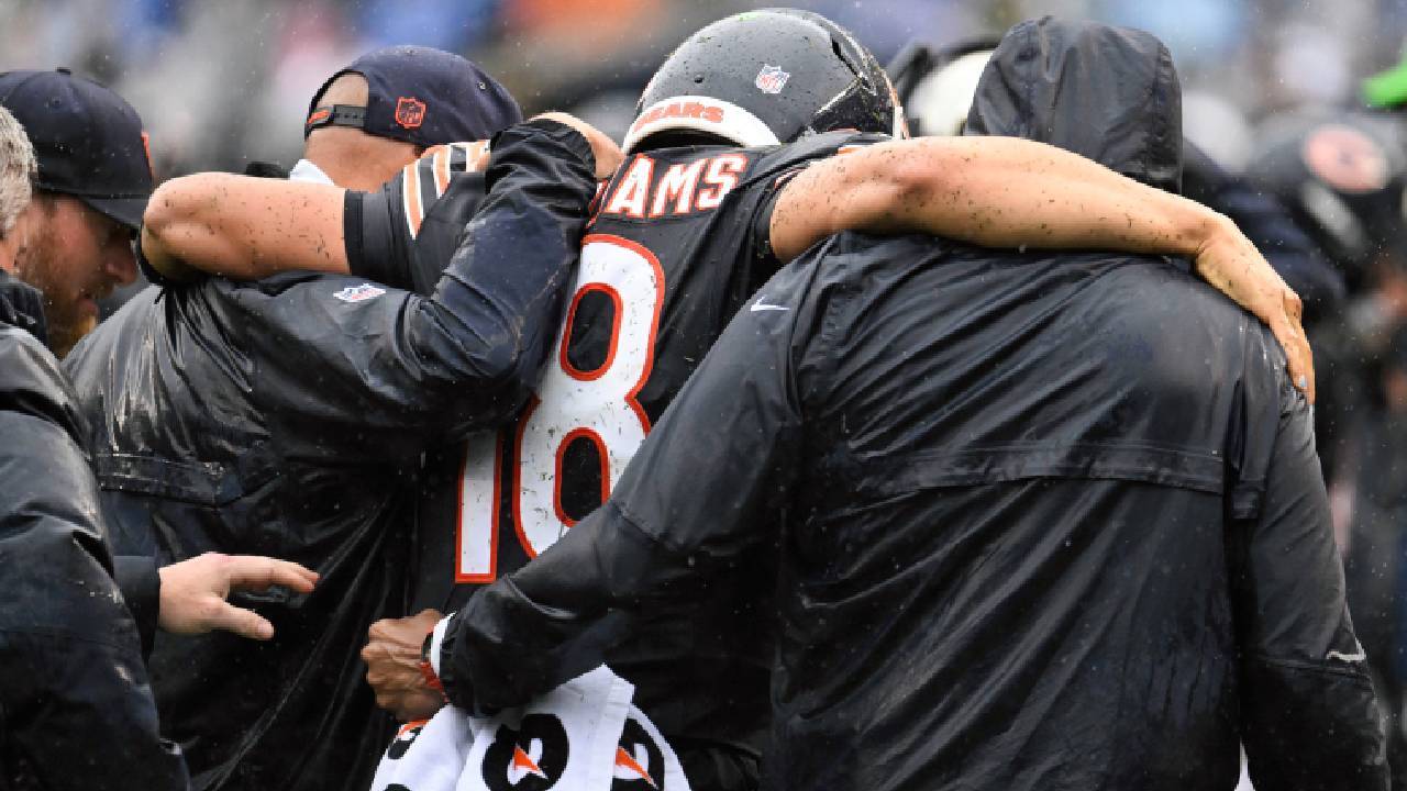 Caleb Williams Injury update: Chicago Bears quarterback Caleb Williams (18) is helped off the field with an apparent injury against the Minnesota Vikings during the second half at Soldier Field.