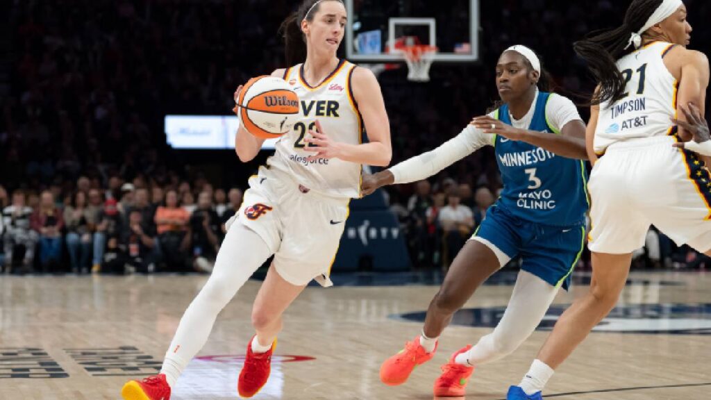 Caitlin Clark dribbles past Minnesota Lynx guard Maya Caldwell during the Indiana Fever’s Sept. 24, 2026, game at Target Center.