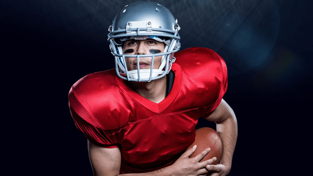 Football player running the ball.