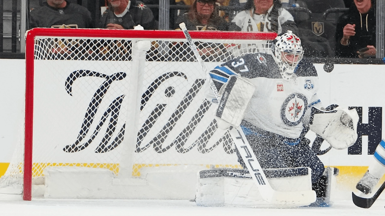 Apr 13, 2026; Las Vegas, Nevada, USA; Winnipeg Jets goaltender Connor Hellebuyck (37) makes a save against the Vegas Golden Knights during the first period at T-Mobile Arena. Mandatory Credit: Stephen R. Sylvanie-Imagn Images
