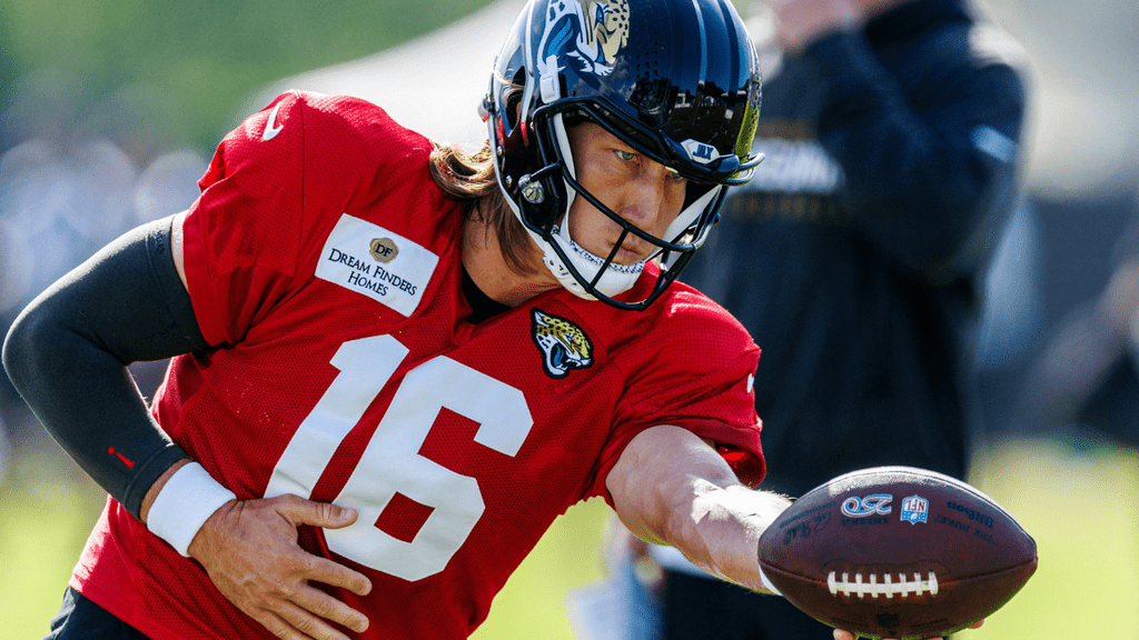 Trevor Lawrence practicing a handoff