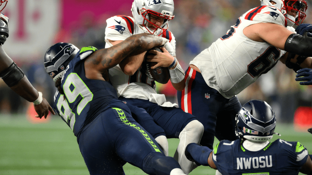 Sep 9, 2026; Seattle, Washington, USA; Seattle Seahawks defensive tackle Leonard Williams (99) sacks New England Patriots quarterback Drake Maye (10) during the fourth quarter at Lumen Field. Mandatory Credit: Steven Bisig-Imagn Images