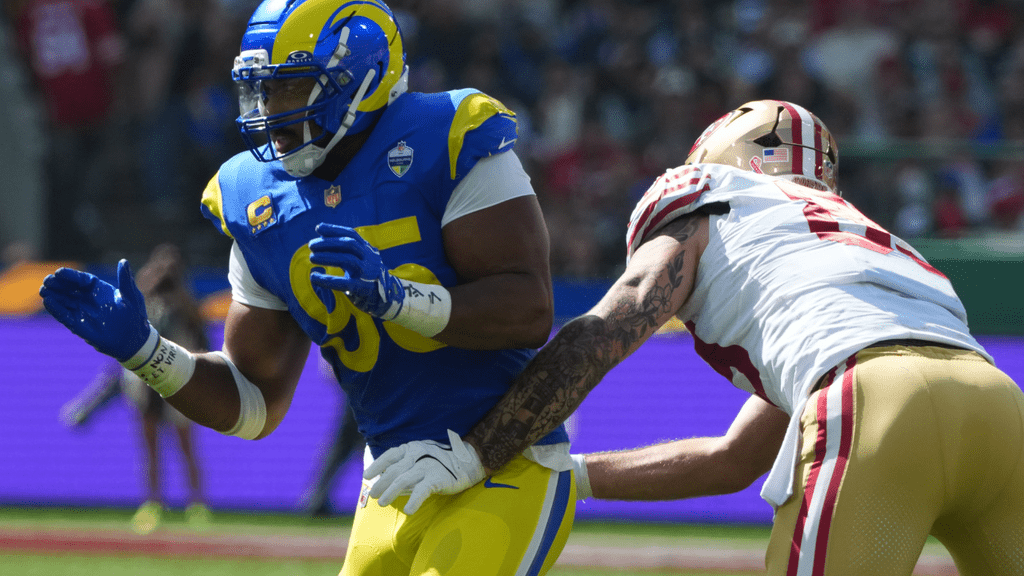 Sep 11, 2026; Melbourne, AUS; Los Angeles Rams defensive end Myles Garrett (95) plays defense against the San Francisco 49ers at Melbourne Cricket Ground. Mandatory Credit: Kirby Lee-Imagn Images