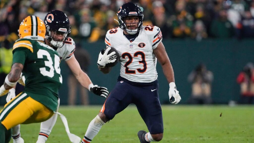 Chicago Bears ground game contributor Roschon Johnson rushes against the Green Bay Packers at Lambeau Field during the 2023 season.