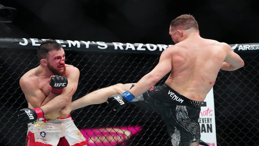 UFC 333 predictions: Petr Yan lands a body kick on Merab Dvalishvili.