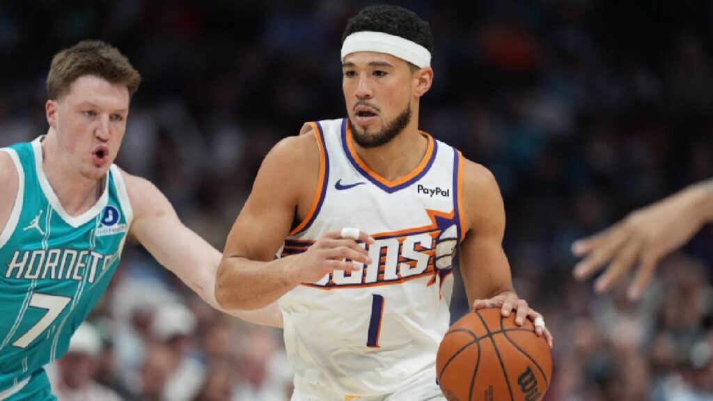 Devin Booker handles the ball against Charlotte as Phoenix Suns Training Camp builds a more positionless offense around its star guard.