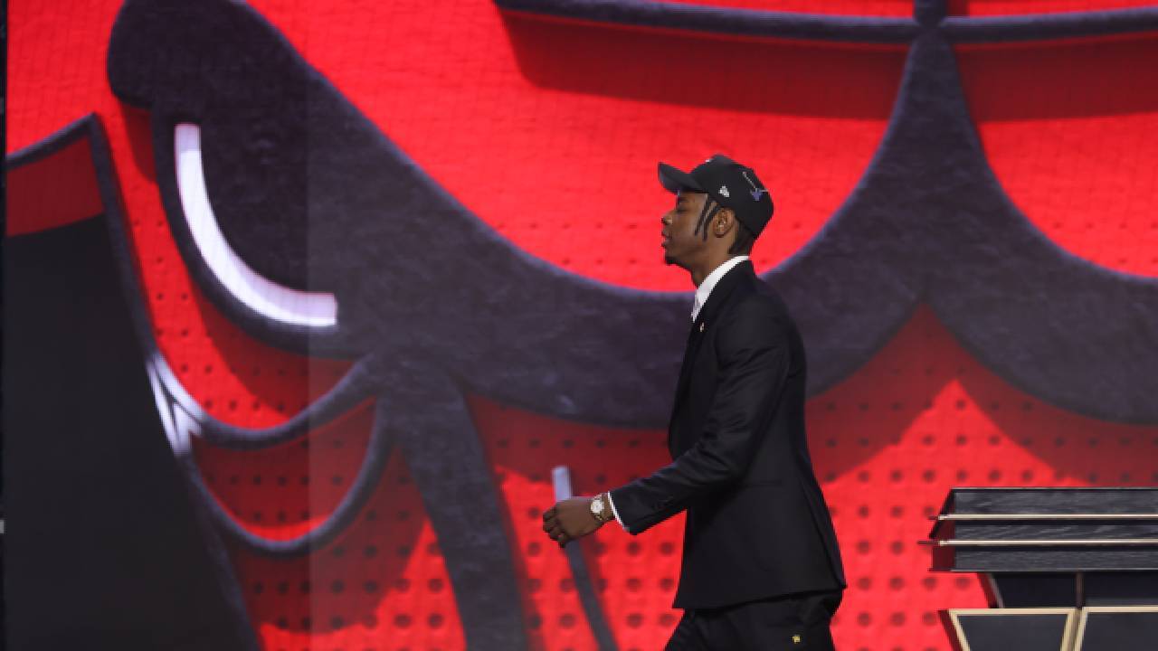 Chicago Bulls Training Camp rookie Caleb Wilson walks across the stage after Chicago selected the North Carolina forward fourth overall in the 2026 NBA Draft.