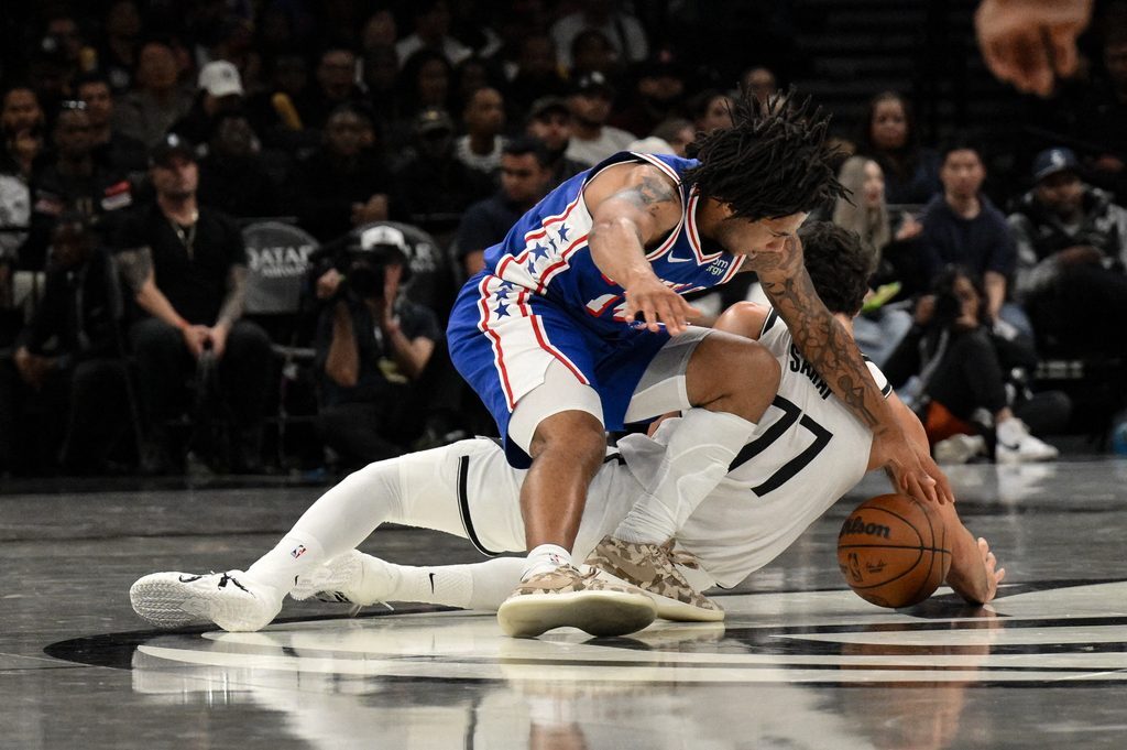 Oct 8, 2026; Brooklyn, New York, USA; Philadelphia 76ers guard Jameer Nelson Jr. (14) and Brooklyn Nets guard Ben Saraf (77) compete for a loose ball during the second half at Barclays Center. Mandatory Credit: John Jones-Imagn Images. Wizards.