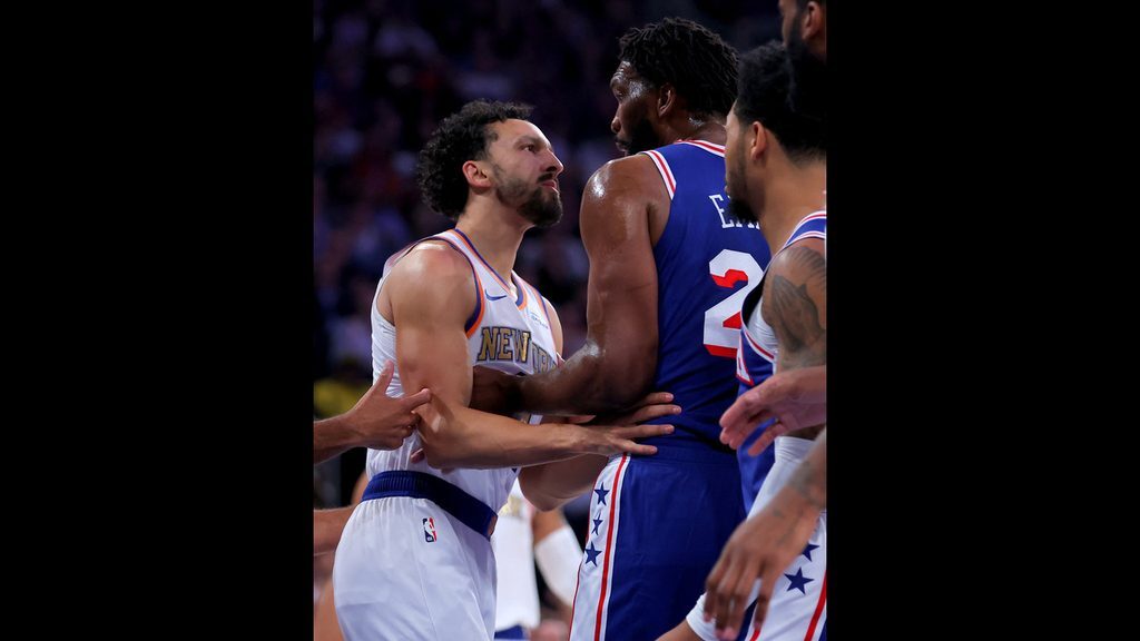 Landry Shamet and Joel Embiid go at each other in the Knicks season opener