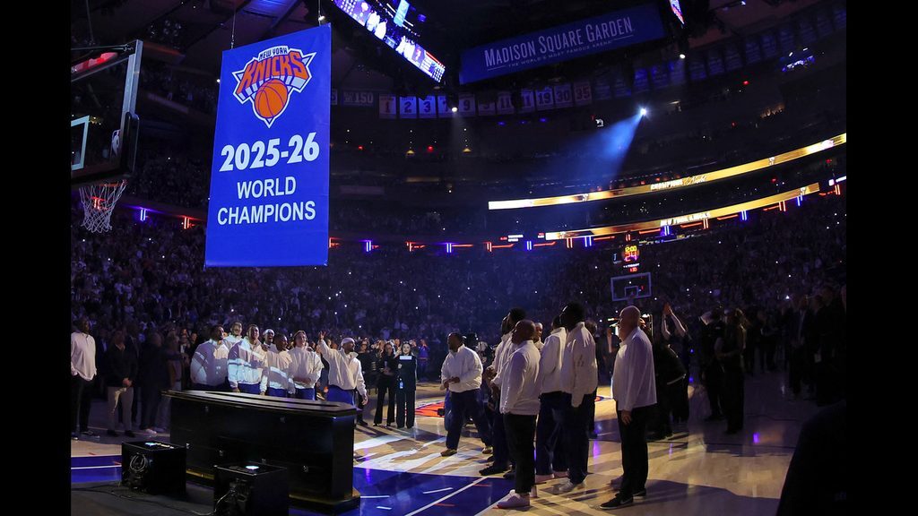The Knicks watch their championship banner rise to the rafters ahead of opening night