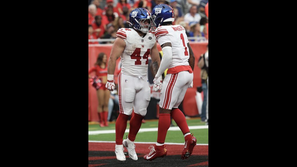 Cam Skattebo celebrates his touchdown with Malik Nabers in the Giants win over the Texans