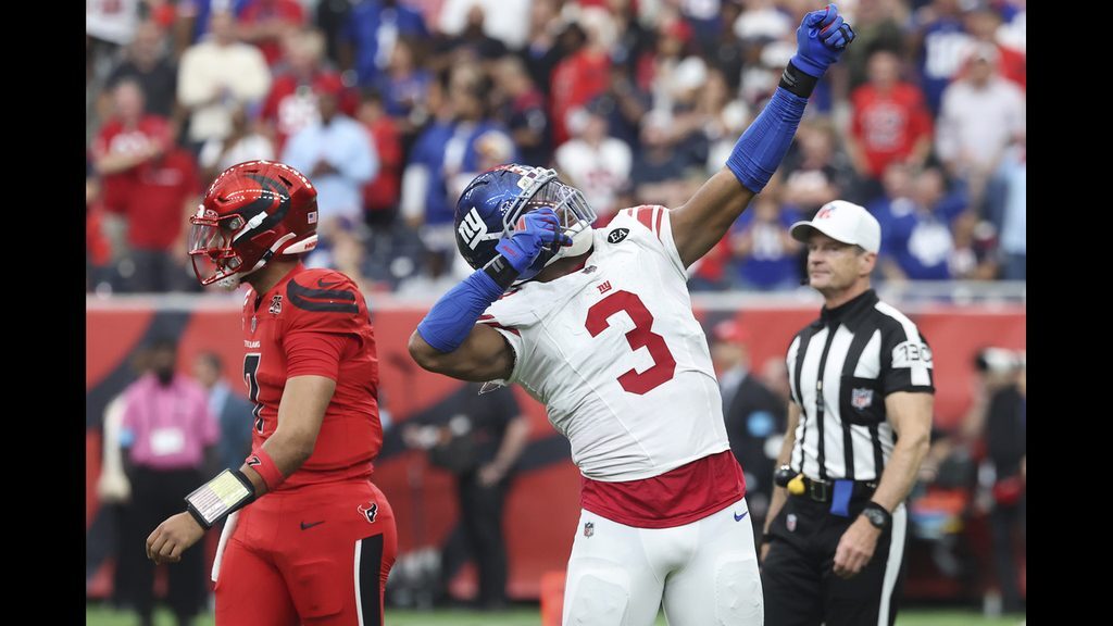 Abdul Carter celebrates a stop on fourth down that gave the Giants possession in overtime