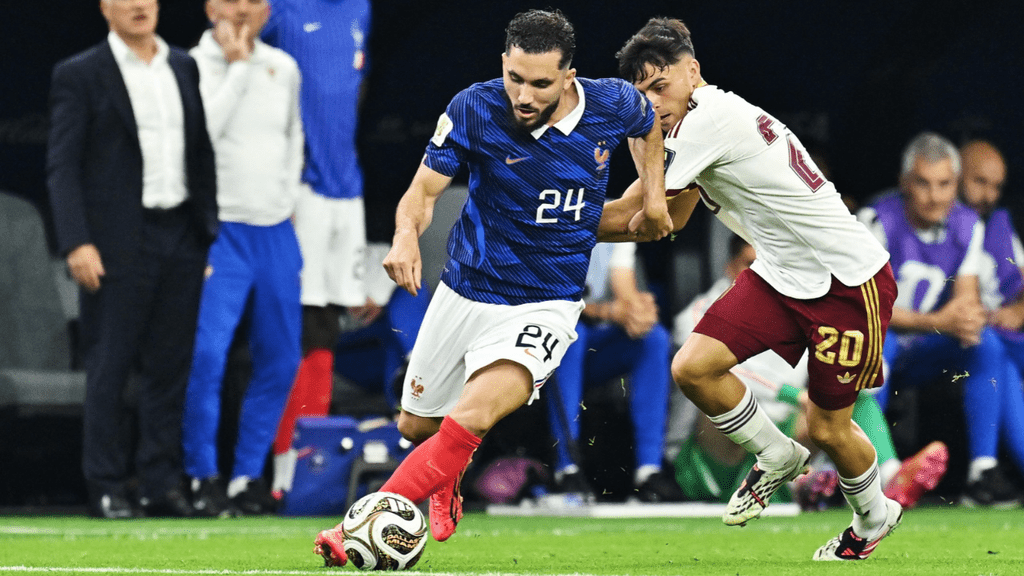 France's Rayan Cherki showed his unique dribbling skills against Belgium. In this photo, he dribbles past Spanish midfielder Pedri.