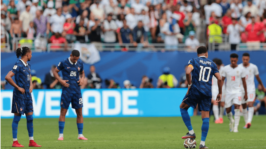 France's stars are in despair as England scores their fifth goal against them. 