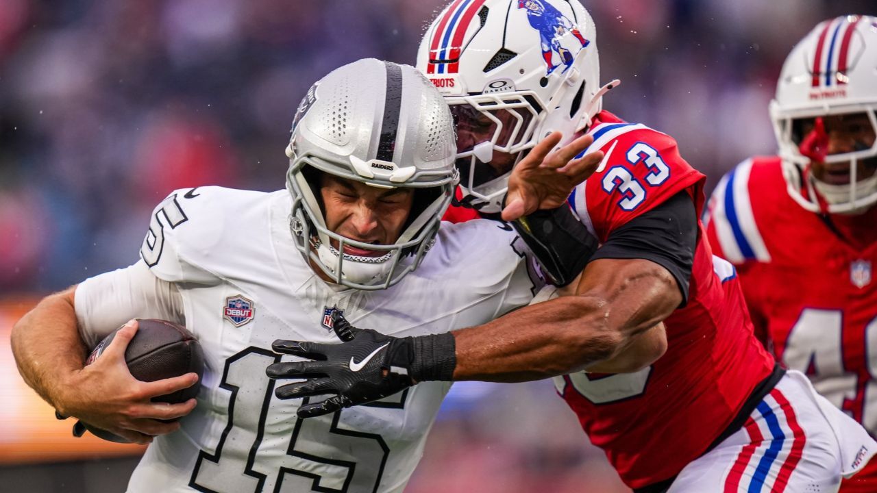 Patriots' safety Mike Brown tackling Fernando Mendoza.