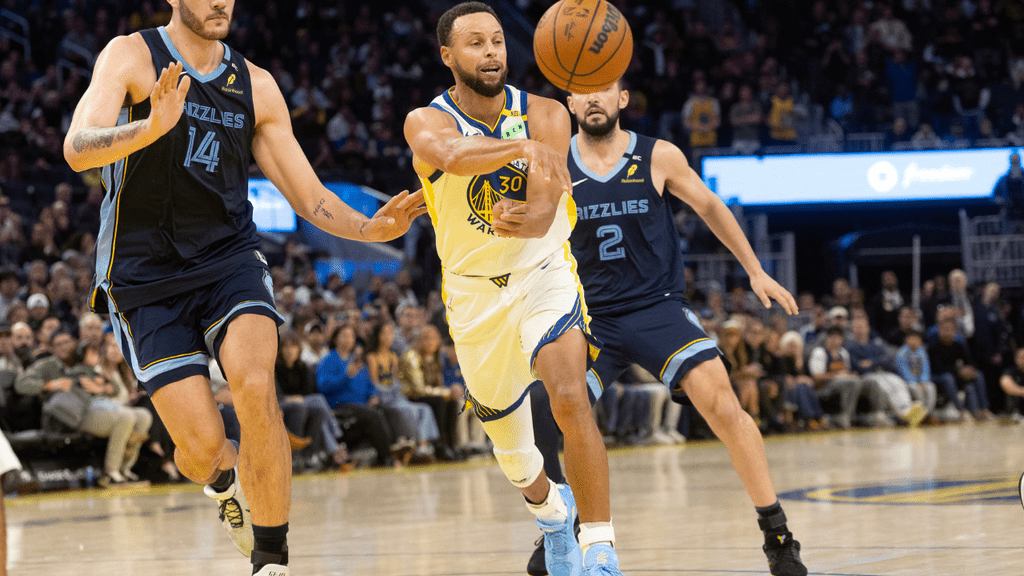 NBA. Oct 23, 2026; San Francisco, California, USA; Golden State Warriors guard Stephen Curry (30) passes away from defensive pressure by Memphis Grizzlies center Zach Edey (14) during the fourth quarter at Chase Center. Mandatory Credit: D. Ross Cameron-Imagn Images
