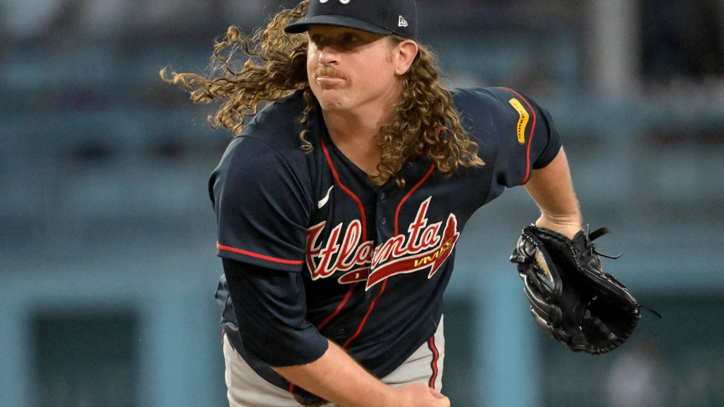 Oct 4, 2026; Los Angeles, California, USA; Atlanta Braves pitcher Grant Holmes (66) delivers to the plate during the fourth inning against the Los Angeles Dodgers in game two of the NLDS for the 2026 MLB Playoffs at Uniqlo Field at Dodger Stadium. Mandatory Credit: Jayne Kamin-Oncea-Imagn Images