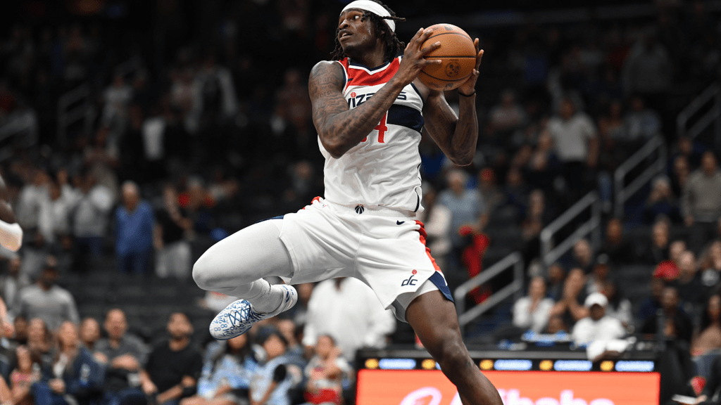 Oct 10, 2026; Washington, District of Columbia, USA; Washington Wizards forward Felix Okpara (34) saves the ball from going out of bounds against the Detroit Pistons during overtime at Capital One Arena. Mandatory Credit: Rafael Suanes-Imagn Images