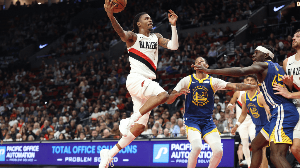 Oct 7, 2026; Portland, Oregon, USA; Portland Trail Blazers guard Ja Morant (1) shoots the ball over Golden State Warriors forward Dalen Terry (21) during the first half at Moda Center. Mandatory Credit: Jaime Valdez-Imagn Images. Trail Blazers.