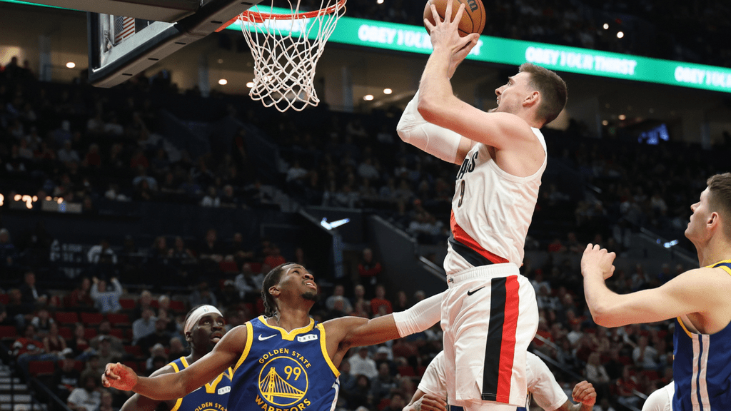 Oct 7, 2026; Portland, Oregon, USA; Portland Trail Blazers center Micah Potter (9) shoots the ball over Golden State Warriors guard Miles Kelly (99) during the second half at Moda Center. Mandatory Credit: Jaime Valdez-Imagn Images