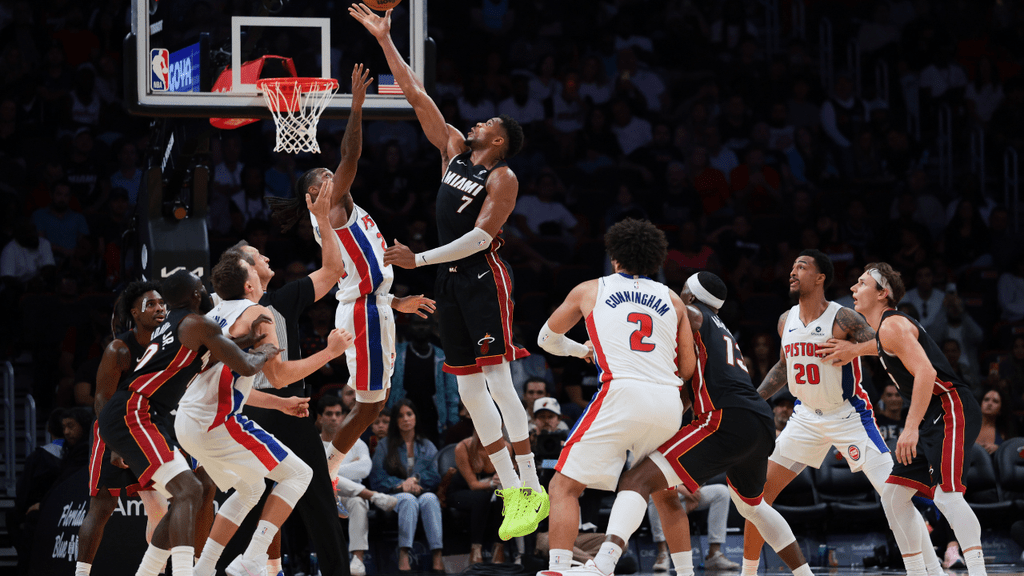 Oct 23, 2026; Miami, Florida, USA; Miami Heat forward Giannis Antetokounmpo (7) and Detroit Pistons guard Daniss Jenkins (24) jump ball during the fourth quarter at Kaseya Center. NBA. Mandatory Credit: Sam Navarro-Imagn Images