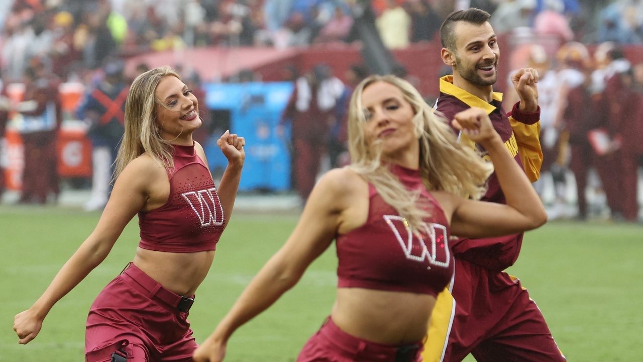 Oct 11, 2026; Landover, Maryland, USA; Members of the Washington Commanders Command Force dance during a timeout against the New York Giants at Northwest Stadium. Mandatory Credit: Geoff Burke-Imagn Images