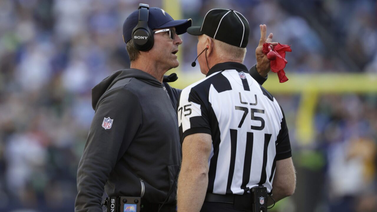 NFL penalties 2026 referee signaling a penalty during a game