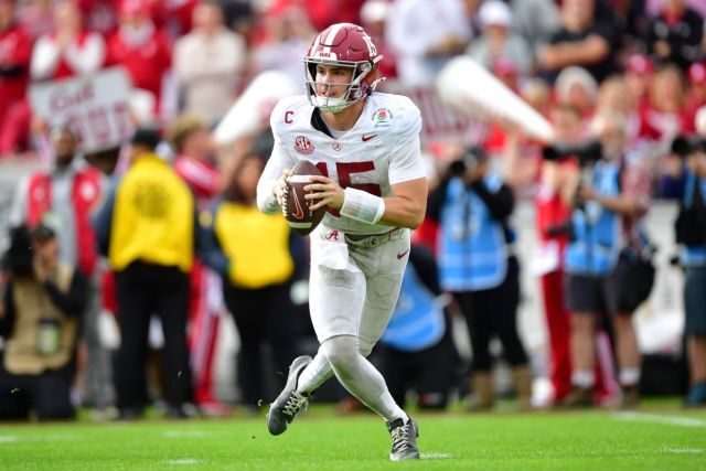 Ty Simpson rolling out to pass