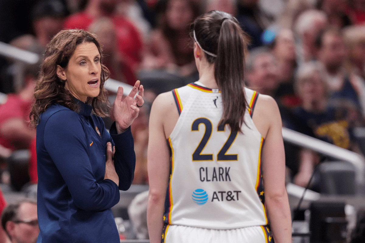 Indiana Fever head coach Stephanie White talks with Indiana Fever guard Caitlin Clark (22) on Wednesday, June 24, 2026, during the first half of a game at Gainbridge Fieldhouse in Indianapolis. The Phoenix Mercury defeated the Indiana Fever, 111-109.