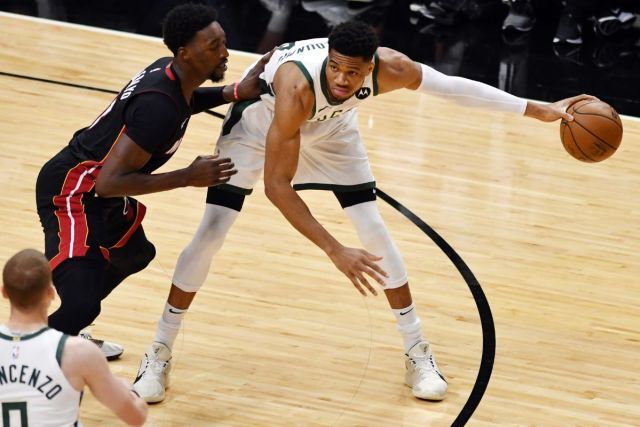 Miami Heat Bam Adebayo defending Giannis Antetokounmpo